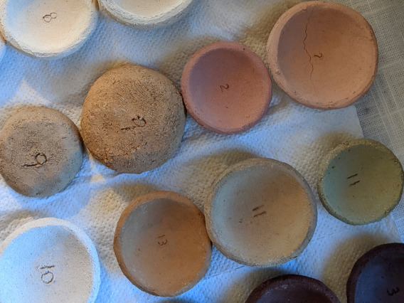 Small pottery samples in a variety of clays/colors