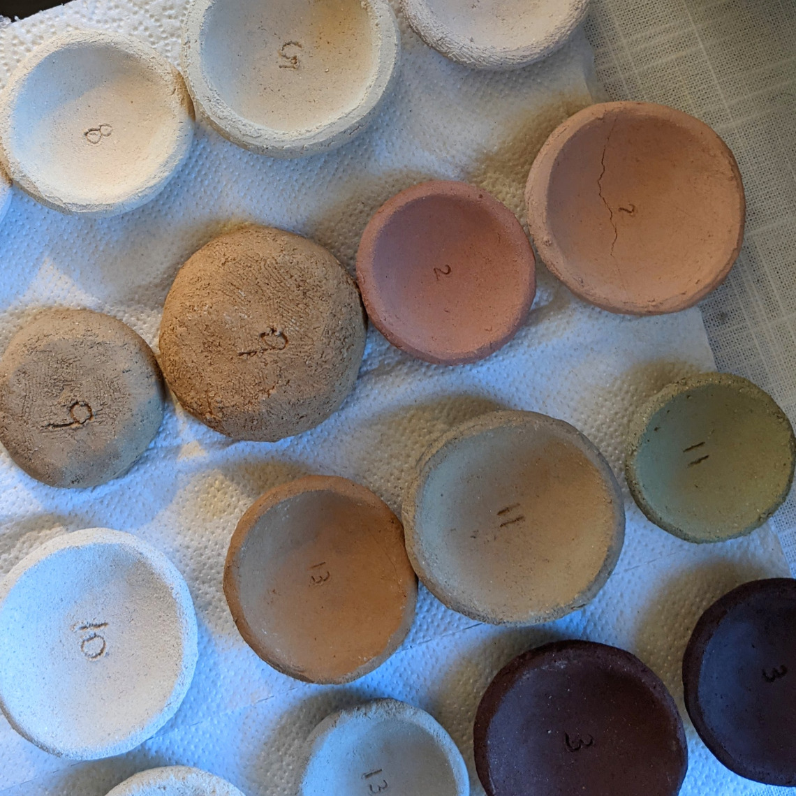 Small pottery samples in a variety of clays/colors