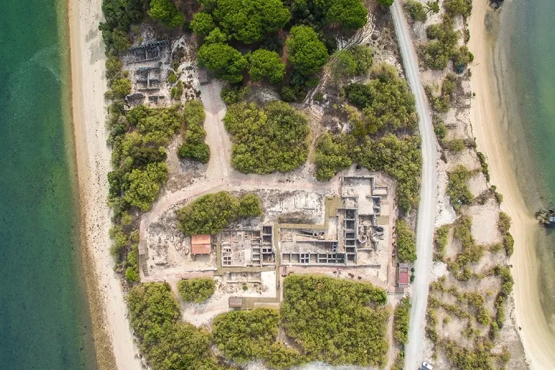 top view of an island with buildings between coastlines