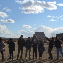 group of students with mesa and hills in the background