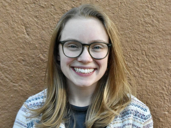 Woman with glasses smiling 