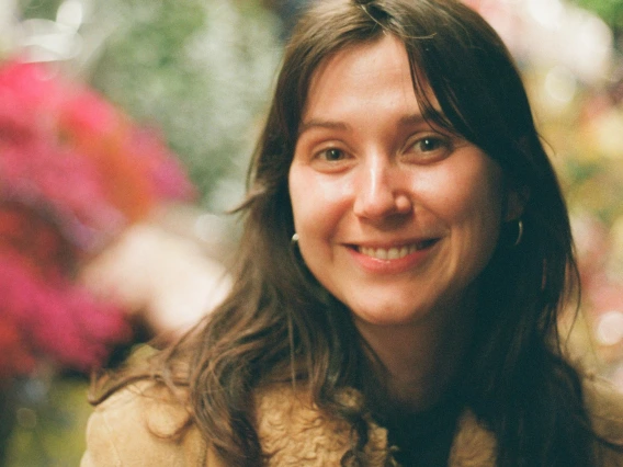 woman smiling for a photograph 