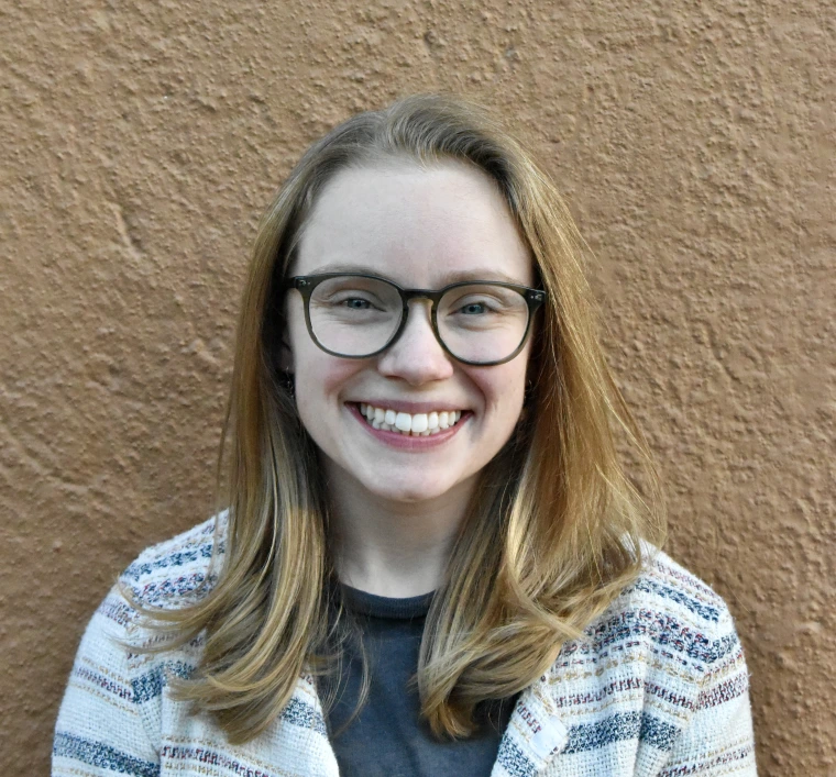 Woman with glasses smiling 