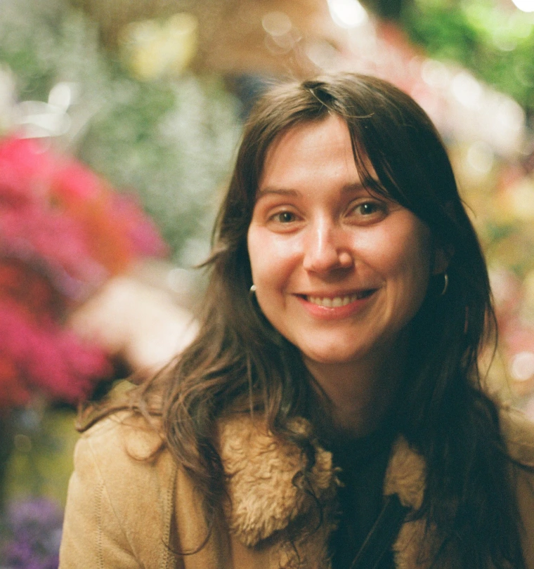 woman smiling for a photograph 