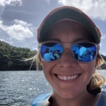 Dani Phelps in ball cap and mirrored sunglasses